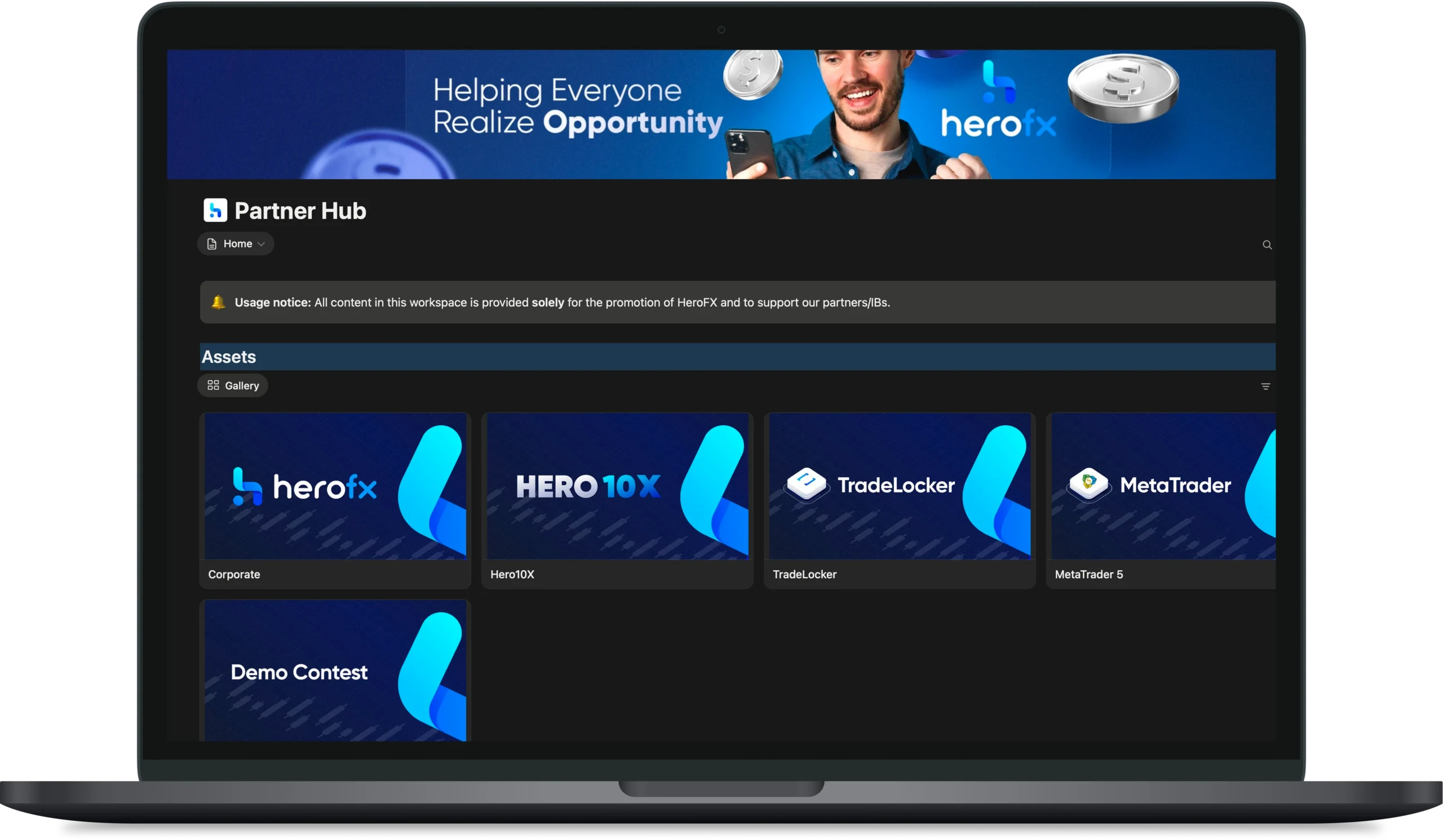 HeroFX Partner Hub marketing toolkit on a laptop